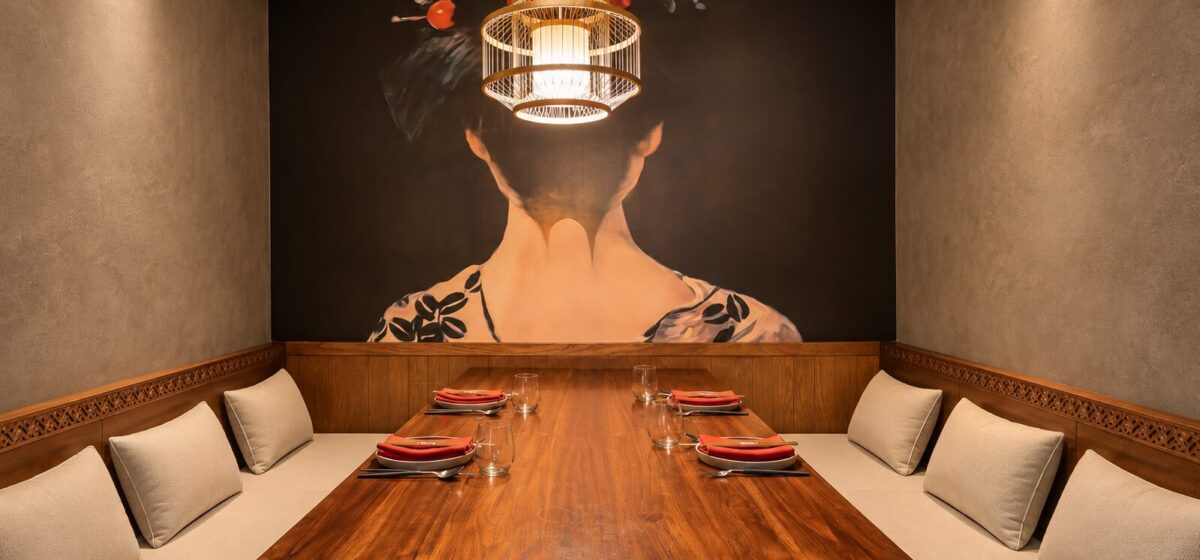 Symmetrical Walnut Dining Room with Mural